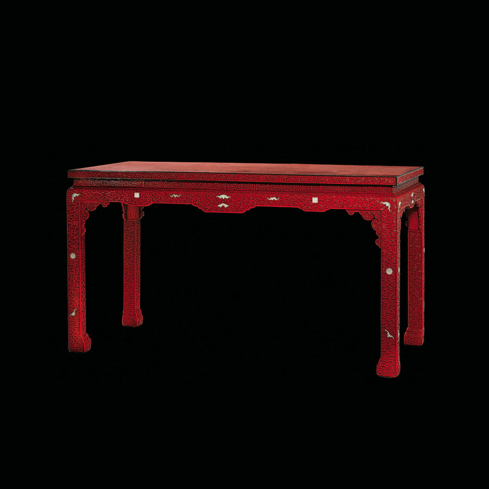 A cinnabar lacquer table inlaid with Jade