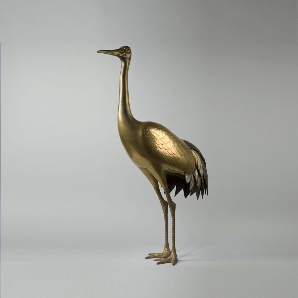 A large gold lacquer incense burner in the form of a standing crane