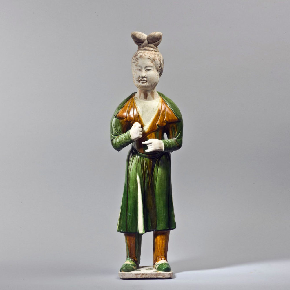 A sancai glazed terracotta standing figure of a groom