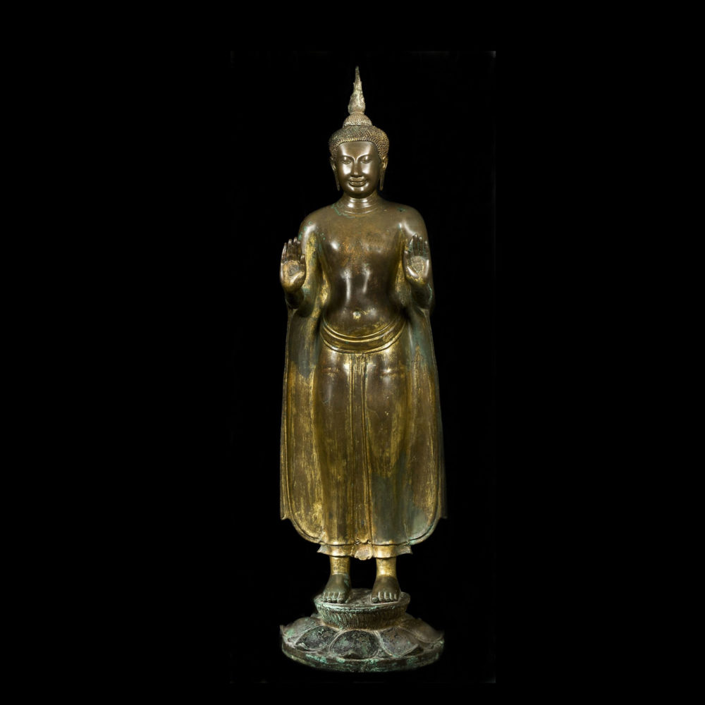 A standing gilt bronze Buddha